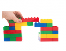 hand building a colorful bridge made out of toy blocks